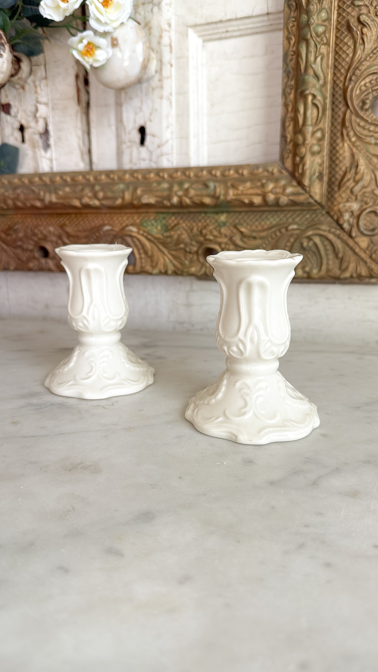 Pair of Ivory Embossed Porcelain Candlestick Holders